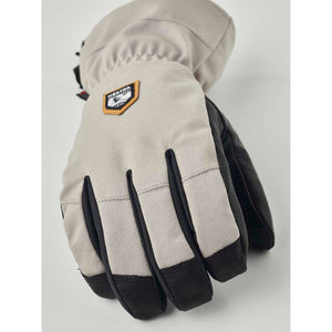 Hestra beige and black ski glove with leather palm and logo patch