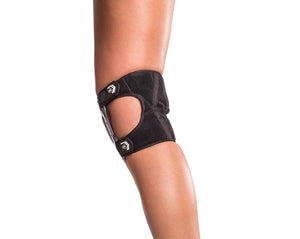 Black hinged knee brace worn on a leg