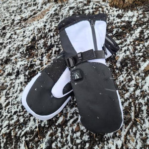 Aheata black and white heated mittens on snowy ground