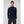 Woman wearing a navy Helly Hansen quarter zip fleece pullover