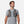Man wearing a grey Nathan hydration vest over a grey t-shirt