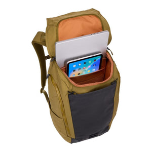Thule backpack with open main compartment containing a laptop and tablet
