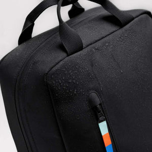 Got Bag black backpack with water droplets on the surface and a zippered pocket