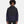 Man wearing a black and navy Under Armour hooded pullover jacket