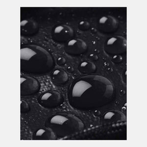 Water droplets on black Under Armour water resistant fabric
