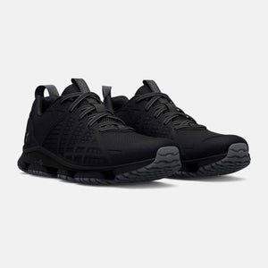 Under Armour black athletic training shoes with mesh upper and textured sole