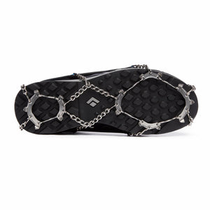 Black Diamond traction spikes attached to the sole of a black hiking shoe