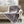 Woolrich grey geometric pattern heated throw blanket with white sherpa lining on a beige sofa