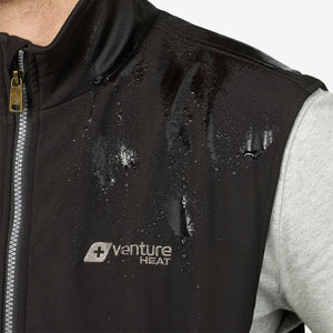 Water beading on the surface of a black Venture Heat vest