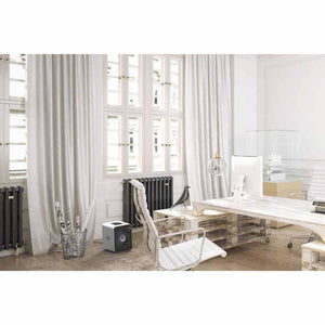 Vornado air circulator placed on the floor in a modern home office