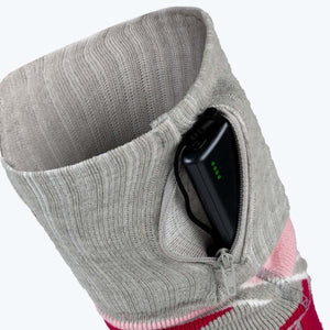 Grey knit sock cuff with a zippered pocket containing a black battery pack