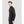 Man wearing a black long sleeve mock neck base layer top