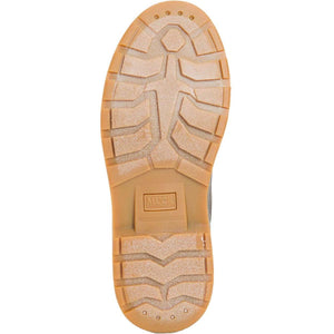 Tan rubber lug sole of a Muck boot