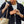 Person holding a tan Bellroy leather zip wallet