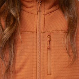 Close up of FjallRaven orange ribbed fleece jacket with chest zipper pocket