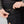 Close up of FjallRaven trousers showing a hand placing a smartphone into a buttoned leg pocket