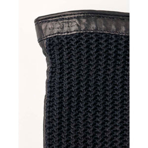 Close up of Hestra black leather and knit glove cuff