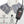 Grey heated neck wrap with digital controller showing heat settings and safety features