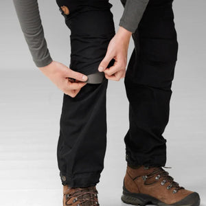 Person inserting knee pad into FjallRaven trousers