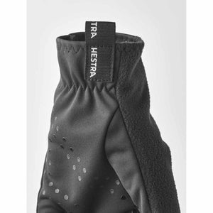 Black Hestra glove cuff with branded pull tab and grip texture