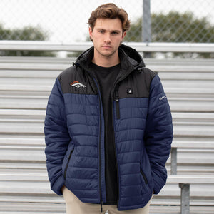 Man wearing a navy and black ActionHeat Denver Broncos hooded puffer jacket