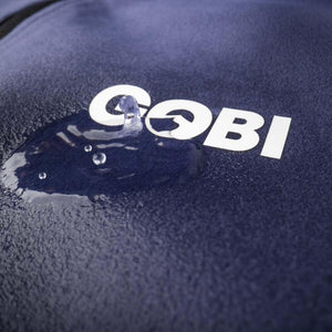 Water beading on a dark blue fabric with a white Gobi logo