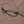 Brown fabric cover with black elastic cord and plastic hook