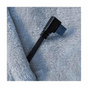 Right angle USB connector resting on grey fleece fabric
