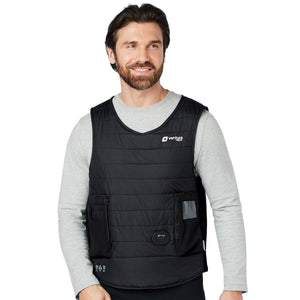 Man wearing a black Venture Heat quilted vest over a grey long sleeve shirt