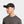 Man wearing a black Mission baseball cap