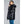 Woman wearing a black shiny hooded puffer jacket