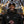 Man wearing ActionHeat Raiders branded jacket and beanie holding a football