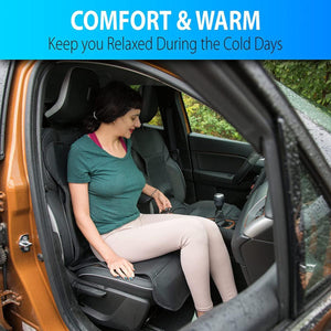 Woman sitting in a car seat using a heated seat cushion controller