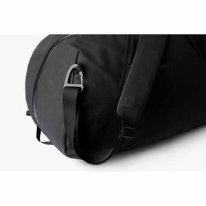 Close up of black Bellroy duffel bag shoulder strap and metal carabiner