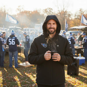 Man wearing ActionHeat Tennessee Titans hooded jacket holding a steaming mug at a tailgate