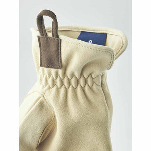 Hestra beige suede glove cuff with brown pull tab and elasticated wrist detail
